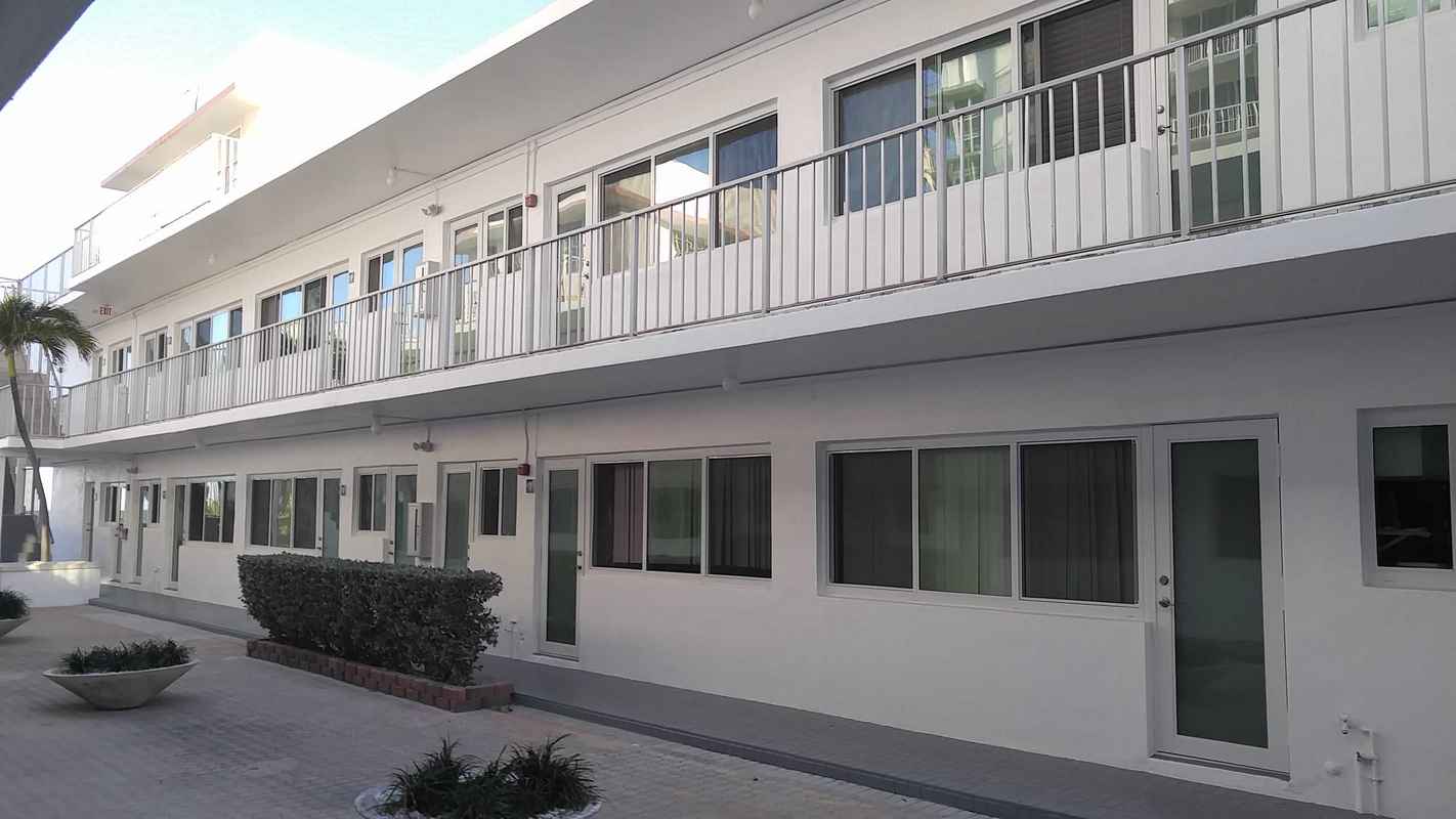 Surfside condominium impact French doors and horizontal rolling windows